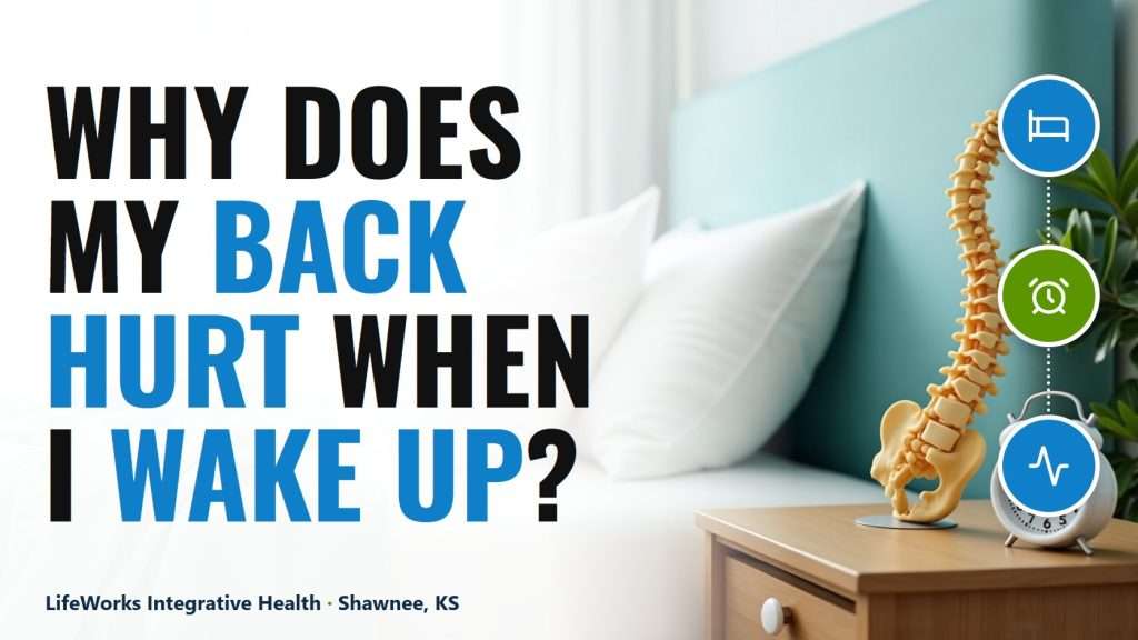 Featured image asking why does my back hurt when I wake up, with a lumbar spine model and alarm clock on a bedside nightstand